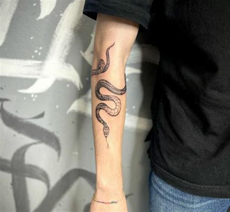 snake gucci tattoo|snake wrapping around forearm tattoo.